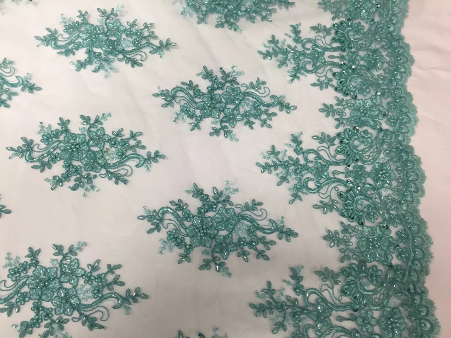 Aqua marvelous design embroider and beaded on a mesh lace-prom-nightgown-decorations-dresses-sold by the yard.