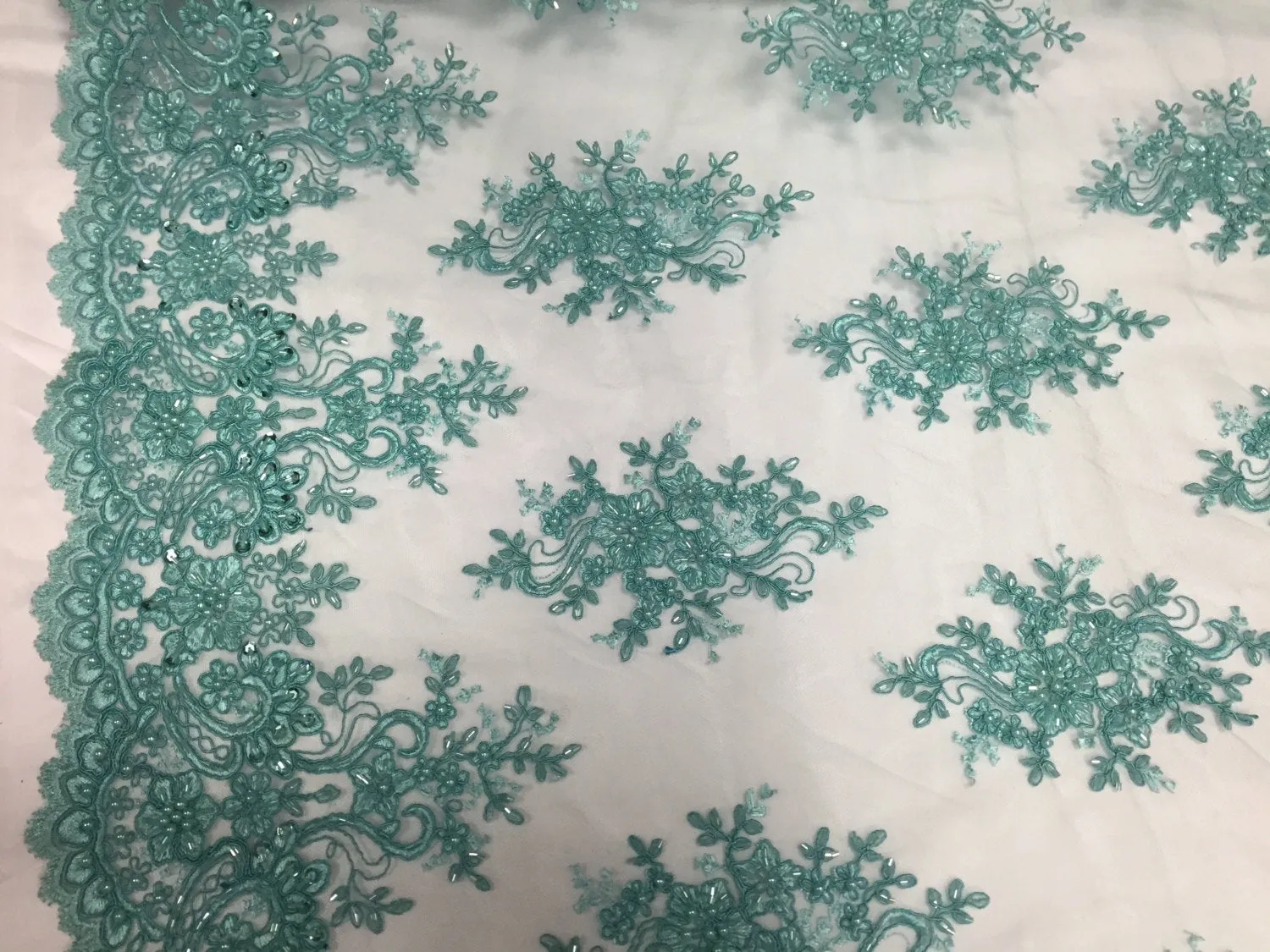 Aqua marvelous design embroider and beaded on a mesh lace-prom-nightgown-decorations-dresses-sold by the yard.