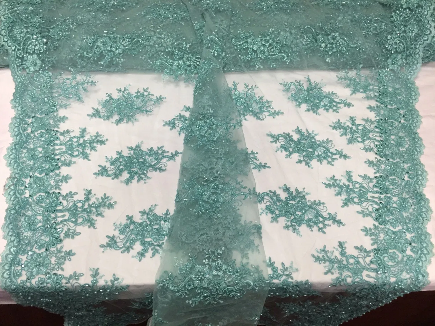 Aqua marvelous design embroider and beaded on a mesh lace-prom-nightgown-decorations-dresses-sold by the yard.