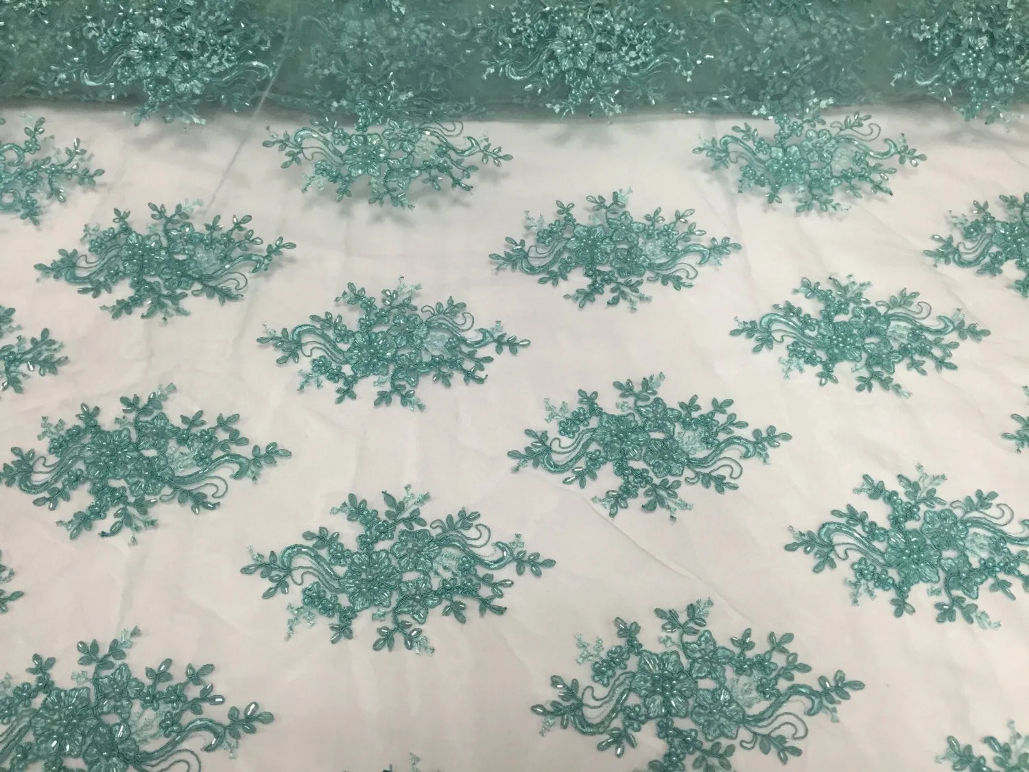 Aqua marvelous design embroider and beaded on a mesh lace-prom-nightgown-decorations-dresses-sold by the yard.