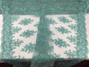 Aqua marvelous design embroider and beaded on a mesh lace-prom-nightgown-decorations-dresses-sold by the yard.