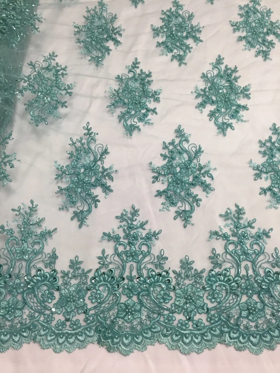 Aqua marvelous design embroider and beaded on a mesh lace-prom-nightgown-decorations-dresses-sold by the yard.